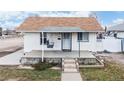 Charming bungalow with a front porch and well-maintained landscaping at 480 N 6Th Ave, Brighton, CO 80601