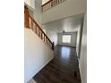 Entryway with hardwood floors and staircase at 2604 S Dunkirk Ct, Aurora, CO 80013