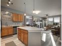 Modern kitchen with island and stainless steel appliances at 10184 Park Meadows Dr # 1112, Lone Tree, CO 80124