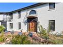 Elegant home entrance with a large wooden door and brick facade at 1490 Saint Andrews Dr, Broomfield, CO 80020