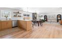 Bright, updated kitchen with light wood cabinets and island at 417 S Pontiac Way, Denver, CO 80210