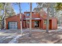 Red two-story home with attached garage at 1415 Golden Gate Dr, Golden, CO 80403