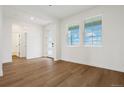 Bright and spacious entryway with light wood flooring and modern doors at 42980 Colonial Trl, Elizabeth, CO 80107