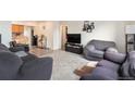 Spacious living room with hardwood floors and ample natural light at 4545 Raritan St, Denver, CO 80211