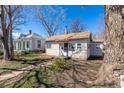 Front view of a charming bungalow-style home at 1709 Arapahoe Ave, Boulder, CO 80302