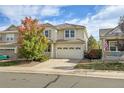 Two-story house with a two-car garage and autumn foliage at 3445 Dinosaur, Castle Rock, CO 80109