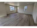 Spacious living room with hardwood floors and lots of natural light at 8333 Vona Ln, Littleton, CO 80125