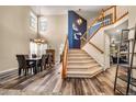 Bright and spacious entryway with a staircase and hardwood floors at 20469 E Mansfield Ave, Aurora, CO 80013