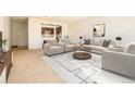 Bright living room featuring neutral colors, comfortable seating, and a coffee table at 13961 E Marina Dr # 106, Aurora, CO 80014