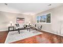 Spacious living room featuring hardwood floors and ample natural light at 10492 Hyacinth St, Highlands Ranch, CO 80129