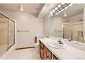 Bathroom with a shower/tub combo and a vanity with a single sink at 7695 E Quincy Ave # 102, Denver, CO 80237