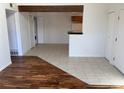 Open dining area with hardwood and tile floors, adjacent to kitchen at 11901 E Harvard Ave # 203, Aurora, CO 80014