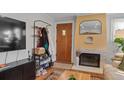 Living room featuring a coat rack and TV at 3440 Newton St, Denver, CO 80211