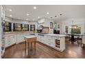 Spacious kitchen with an island and hardwood floors at 20127 Aintree Ct, Parker, CO 80138