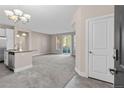 Bright and spacious entryway with tile flooring and access to kitchen and living areas at 14321 E Tennessee Ave # 1-105, Aurora, CO 80012