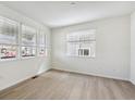 Bright living room with hardwood floors and plenty of natural light at 1140 Colony Dr, Erie, CO 80026