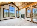 Spacious main bedroom with vaulted ceiling, fireplace, and scenic views at 964 Alpensee Dr, Breckenridge, CO 80424