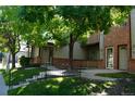 Front exterior of a two-story brick home with a walkway leading to the entrance at 11041 Huron St # 706, Northglenn, CO 80234