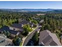 Luxury townhomes nestled in a wooded community at 7591 Pineridge Trl, Castle Pines, CO 80108