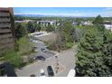 Aerial view showing a tennis court and mountain views at 8060 E Girard Ave # 711, Denver, CO 80231