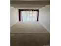 Spacious living room with large windows and carpet at 8060 E Girard Ave # 711, Denver, CO 80231