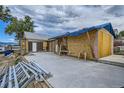 House under construction, showing unfinished garage and exterior wall at 13305 W 82Nd Ave, Arvada, CO 80005
