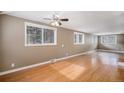 Spacious living room with hardwood floors and ceiling fan at 28532 Shadow Mountain Dr, Conifer, CO 80433