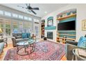 Spacious living room with fireplace, large windows, and comfortable seating at 7193 S Versailles Way, Aurora, CO 80016