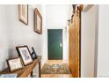 Stylish entryway with barn door and wood accent wall at 1801 Wynkoop St # 205, Denver, CO 80202