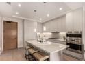 Modern kitchen with island, stainless steel appliances, and quartz countertops at 1901 Wazee St # 719, Denver, CO 80202