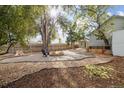 Landscaped backyard featuring a fire pit area, great for entertaining at 2001 Gray St, Edgewater, CO 80214