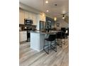 Modern kitchen featuring a large island and stainless steel appliances at 12261 Karls Ln, Northglenn, CO 80241