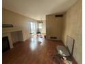 Living room with hardwood floors and a fireplace at 1514 S Buckley Way, Aurora, CO 80017