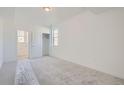 Bright bedroom with neutral carpeting and a large closet at 3230 S Russell St, Morrison, CO 80465