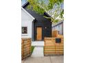 Modern two-tone home with wood fence and walkway at 3744 N Lafayette St, Denver, CO 80205