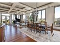 Elegant dining room with hardwood floors, chandelier, and large windows at 2500 E Cherry Creek South Dr # 601, Denver, CO 80209