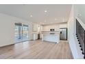 Bright kitchen with island and stainless steel appliances at 1029 Sunrise Dr, Erie, CO 80516