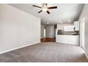 Spacious living room with carpet and views of kitchen at 7318 Arkansas St, Frederick, CO 80530