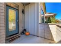 Welcoming front entrance with blue door and stylish welcome mat at 6711 Avrum Dr, Denver, CO 80221