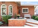 Front of the house with brick facade and landscaping at 1349 Birch St, Denver, CO 80220