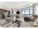 Open concept living room with city views and modern decor at 4200 W 17Th Ave # 823, Denver, CO 80204