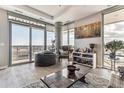 Bright living room with city views and comfortable seating at 4200 W 17Th Ave # 823, Denver, CO 80204