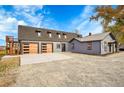 Modern farmhouse exterior with attached garage at 14405 County Road 12, Fort Lupton, CO 80621