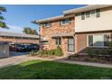 Attractive brick townhouse with landscaping and parking at 9131 E Mansfield Ave, Denver, CO 80237