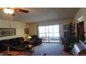 Spacious living room with sliding glass doors leading to a balcony at 13901 E Marina Dr # 308, Aurora, CO 80014