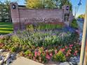 Community entrance with landscaping and signage at 750 S Clinton St # 6B, Denver, CO 80247