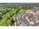 Aerial view of community with homes and golf course at 4673 W 50Th Pl, Denver, CO 80212