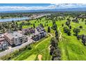 Aerial view of community near golf course and lake at 4673 W 50Th Pl, Denver, CO 80212