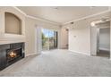 Spacious living room with fireplace and access to balcony at 1801 S Dunkirk St # 303, Aurora, CO 80017