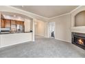 Open kitchen with stainless steel appliances and breakfast bar at 1801 S Dunkirk St # 303, Aurora, CO 80017